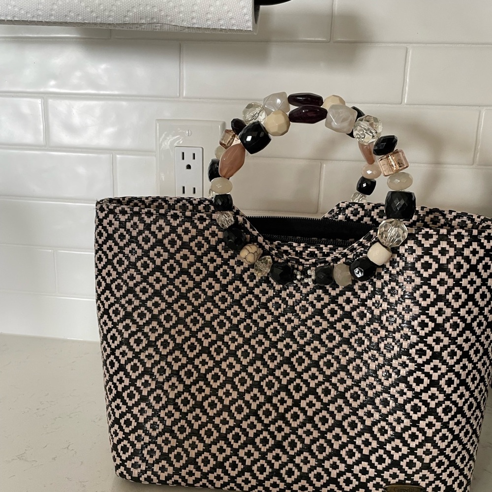 Small fashionable purse used 3 times only bought at Steinmart 6 years ago.